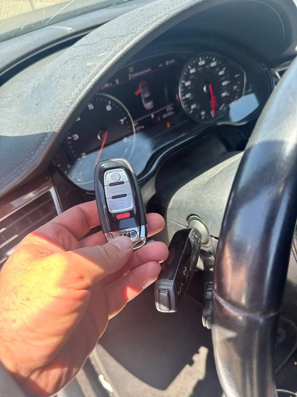 Audi key fob held inside the cabin while a new key is programmed