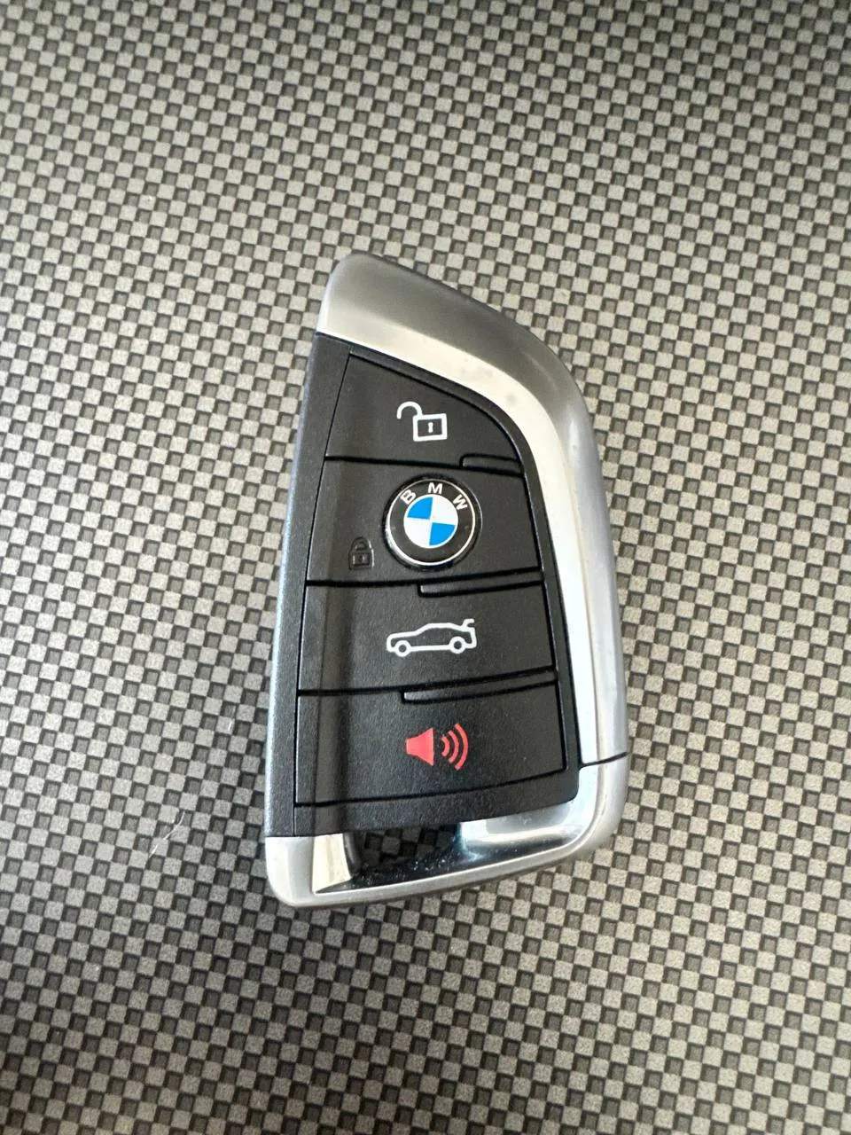 BMW smart key fob photographed during a key programming job by Safe4us